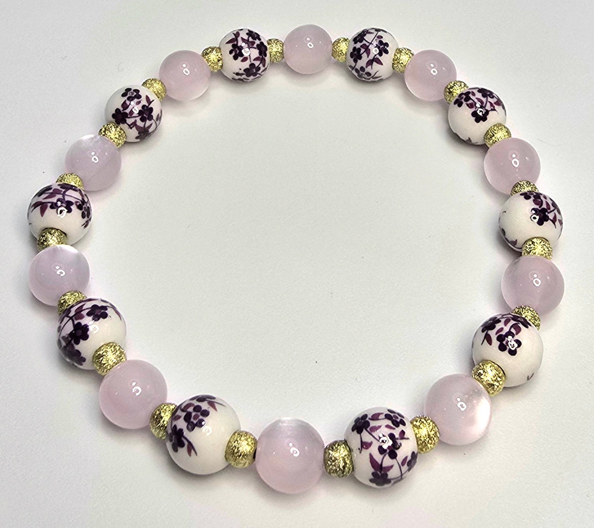 *8mm Ceramic Purple Flower Beads With 8mm Cat Eye Beads & 4mm Gold Beaded Bracelet